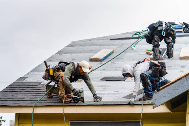 Professional Gutter Installation technician working in Woodville, CA
